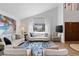 Bright living room featuring high ceilings, a large window, and stylish, comfortable seating at 2425 Greens Ave, Henderson, NV 89014