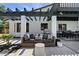 A covered patio with outdoor seating and a dining table perfect for enjoying the outdoors at 2425 Greens Ave, Henderson, NV 89014