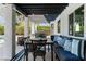 Covered patio with dining and lounge seating, barbecue, and views of the pool and yard at 2425 Greens Ave, Henderson, NV 89014
