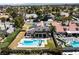 Aerial view of a home featuring a refreshing pool, a covered patio, and solar panels on the roof at 2425 Greens Ave, Henderson, NV 89014