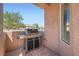 Outdoor grill station under a covered patio, perfect for backyard barbecues at 2509 Libretto Ave, Henderson, NV 89052