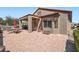 Outdoor patio features a covered dining area with BBQ grill and landscaped greenery at 2509 Libretto Ave, Henderson, NV 89052