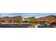 Contemporary building featuring modern architecture, landscaping, and ample parking at 2509 Libretto Ave, Henderson, NV 89052