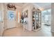 Welcoming foyer with tile flooring, white trim, and a decorative glass door at 2509 Libretto Ave, Henderson, NV 89052