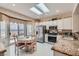 Bright kitchen with stainless steel appliances, granite counters, and a breakfast nook at 2509 Libretto Ave, Henderson, NV 89052