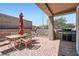 Spacious covered outdoor patio with seating, grill, and brick paving for outdoor entertaining at 2509 Libretto Ave, Henderson, NV 89052
