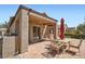 Outdoor patio featuring a dining table with an umbrella, a grill, and a well-maintained brick surface at 2509 Libretto Ave, Henderson, NV 89052