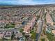 Extensive aerial view of a suburban community with desert landscape stretching to the horizon at 2554 Braehead Ln, Henderson, NV 89044