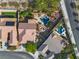 Aerial view showcasing a luxurious backyard with a stunning pool, lush landscaping, and ample space for outdoor living at 2554 Braehead Ln, Henderson, NV 89044