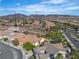 This aerial shot shows desert homes near mountains and showcases the expansive community at 2554 Braehead Ln, Henderson, NV 89044