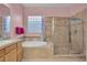 Stylish bathroom featuring a bathtub, shower and a decorative window for added privacy and charm at 2554 Braehead Ln, Henderson, NV 89044