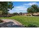 Scenic community park featuring a lush lawn, walking trails, and a covered picnic area for outdoor gatherings at 2554 Braehead Ln, Henderson, NV 89044