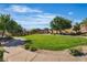 Beautiful community park with expansive green space, walking trails, and seating areas for relaxation and recreation at 2554 Braehead Ln, Henderson, NV 89044