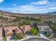Scenic view of homes in the community surrounded by desert landscape and clear blue sky at 2554 Braehead Ln, Henderson, NV 89044