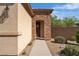 Front entrance with a decorative wreath, rock accents, and a walkway at 2554 Braehead Ln, Henderson, NV 89044