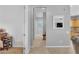 Hallway leading to dining room showing neutral paint and decor with tile floor at 2554 Braehead Ln, Henderson, NV 89044