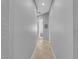 Neutral hallway with ceramic tile flooring leading to adjoining rooms in a well-lit space at 2554 Braehead Ln, Henderson, NV 89044