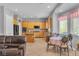Bright kitchen features wooden cabinets, a cozy breakfast nook, and plenty of natural light at 2554 Braehead Ln, Henderson, NV 89044