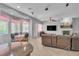 Bright living area with a breakfast nook, living room furniture, and large windows at 2554 Braehead Ln, Henderson, NV 89044