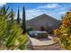 Relaxing patio area with comfortable seating, perfect for enjoying the outdoors in a private backyard at 2554 Braehead Ln, Henderson, NV 89044