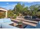 Stunning backyard pool with lush landscaping, offering a serene and private oasis for relaxation and entertainment at 2554 Braehead Ln, Henderson, NV 89044