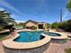 Gorgeous pool and spa combo showcasing a lounge area and landscaped backyard at 2554 Braehead Ln, Henderson, NV 89044