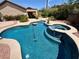 Sparkling pool and spa combination with tanning ledge, surrounded by low-maintenance landscaping at 2554 Braehead Ln, Henderson, NV 89044