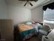 View of bedroom with ceiling fan, window with blinds, and minimal furnishing at 2571 Swans Chance Ave, Henderson, NV 89052