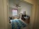 Cozy bedroom featuring natural light, a ceiling fan, and ample space for personalization at 2571 Swans Chance Ave, Henderson, NV 89052