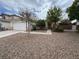 Charming single-Gathering home with a well-maintained front yard, gravel landscaping and a two-car garage at 2571 Swans Chance Ave, Henderson, NV 89052