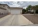 A one story home featuring a two car garage and well manicured yard at 2571 Swans Chance Ave, Henderson, NV 89052