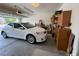 Spacious garage featuring an automatic door opener, ample storage, and parking for a car at 2571 Swans Chance Ave, Henderson, NV 89052