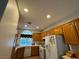 A spacious kitchen with wooden cabinets and recessed lighting at 2571 Swans Chance Ave, Henderson, NV 89052