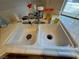 Close up on a dual kitchen sink, and cleaning products at 2571 Swans Chance Ave, Henderson, NV 89052