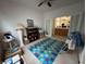 A room with a shelf, lighting, and an access to an office room at 2571 Swans Chance Ave, Henderson, NV 89052