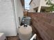 Side yard with pool equipment and a brick wall at 2571 Swans Chance Ave, Henderson, NV 89052