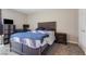 This bedroom features a large bed, a desk area, and neutral walls at 2606 S Durango Dr # 260, Las Vegas, NV 89117