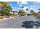 Gated community entrance with lush palm trees creates a secure and welcoming atmosphere at 2606 S Durango Dr # 260, Las Vegas, NV 89117