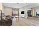 Bright living room featuring a sofa, wood-look floors, and access to a balcony at 2606 S Durango Dr # 260, Las Vegas, NV 89117