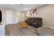 Inviting living room with a cozy gray sofa, world map tapestry, and neutral decor at 2606 S Durango Dr # 260, Las Vegas, NV 89117
