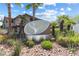 Community sign surrounded by lush greenery and palm trees welcomes residents and visitors at 2606 S Durango Dr # 260, Las Vegas, NV 89117