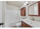 This full bathroom features updated vanity and shower-tub combo at 2805 El Cubano Ct, North Las Vegas, NV 89030