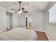 This bedroom has wood floors, a ceiling fan, and a walk-in closet at 2805 El Cubano Ct, North Las Vegas, NV 89030