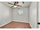 Bedroom featuring wood floors, a ceiling fan, and a window at 2805 El Cubano Ct, North Las Vegas, NV 89030