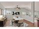 Staged dining room with marble table, modern decor, and neutral color scheme at 2805 El Cubano Ct, North Las Vegas, NV 89030