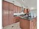 Updated kitchen boasts stainless steel appliances, granite countertops, and plenty of storage at 2805 El Cubano Ct, North Las Vegas, NV 89030