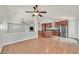 Open floorplan of the living area and kitchen with stainless steel appliances at 2805 El Cubano Ct, North Las Vegas, NV 89030