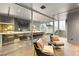 Stylish bar area visible through glass doors, adjacent to a sitting room with unique staircase feature at 3 Horseshoe Rock Ct, Henderson, NV 89012