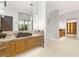Bathroom featuring dual vanities, stone countertops and modern lighting at 3 Horseshoe Rock Ct, Henderson, NV 89012