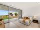 Bright bedroom with sliding doors to a patio, offering picturesque views at 3 Horseshoe Rock Ct, Henderson, NV 89012